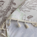 Elegant rectangular tablecloth with delicate bird and botanical prints, featuring charming tassel edges — perfect for adding a touch of nature-inspired style to dining rooms, kitchens, and special gatherings.