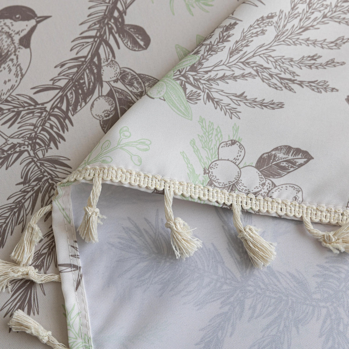 Elegant rectangular tablecloth with delicate bird and botanical prints, featuring charming tassel edges ¡ª perfect for adding a touch of nature-inspired style to dining rooms, kitchens, and special gatherings.
