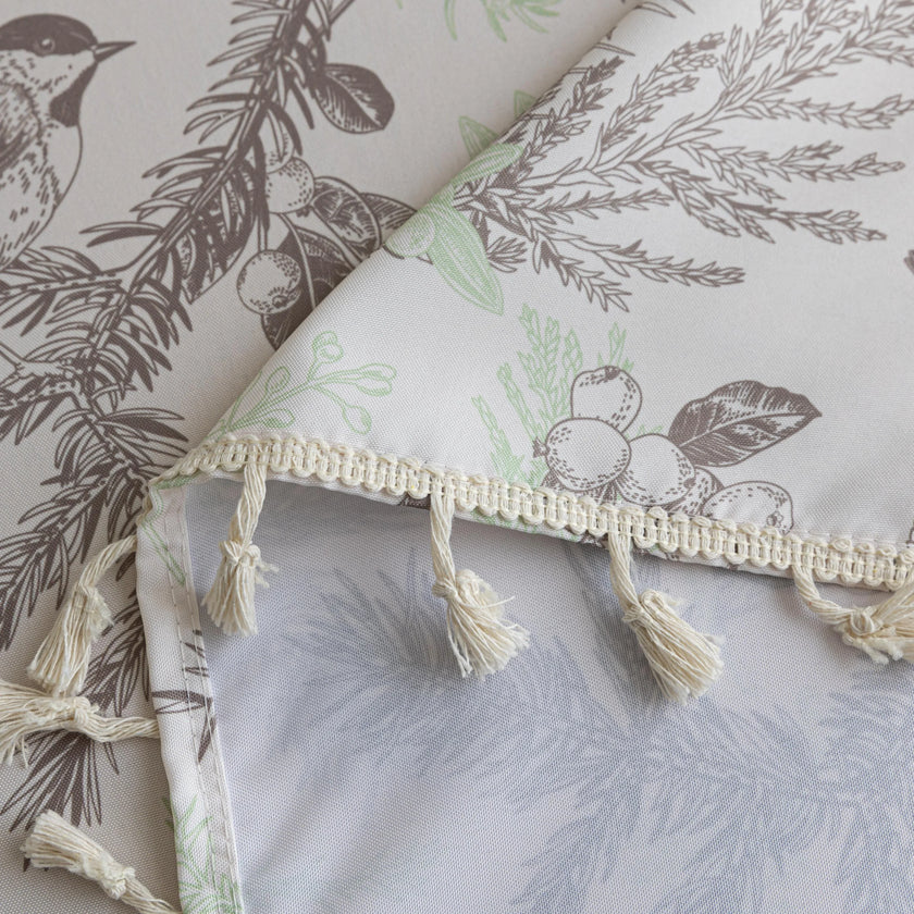 Elegant rectangular tablecloth with delicate bird and botanical prints, featuring charming tassel edges ¡ª perfect for adding a touch of nature-inspired style to dining rooms, kitchens, and special gatherings.