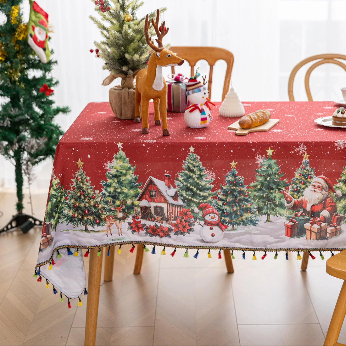 Christmas Santa Rectangular Tablecloth – Create a festive holiday atmosphere with this rectangular tablecloth featuring a snowy Christmas scene of Santa Claus, decorated pine trees, a cozy cottage, reindeer, and a cheerful snowman. Set against a rich red background with falling snowflakes and accented by playful multicolor tassels, it’s perfect for Christmas dinners, holiday parties, and seasonal home décor. Durable and eye-catching, this tablecloth brings warmth and joy to any dining space.
