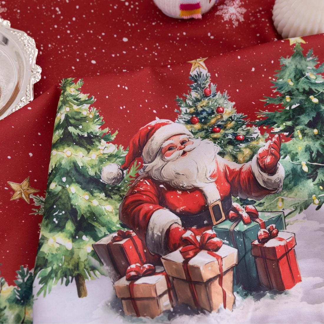 Christmas Santa Rectangular Tablecloth – Create a festive holiday atmosphere with this rectangular tablecloth featuring a snowy Christmas scene of Santa Claus, decorated pine trees, a cozy cottage, reindeer, and a cheerful snowman. Set against a rich red background with falling snowflakes and accented by playful multicolor tassels, it’s perfect for Christmas dinners, holiday parties, and seasonal home décor. Durable and eye-catching, this tablecloth brings warmth and joy to any dining space.
