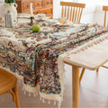 Beautiful bohemian tablecloth with intricate floral patterns and tassel edges, perfect for dining, parties, and festive home décor.