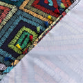Add charm to your dining table with this colored irregular lattice tablecloth, blending vibrant style with durable fabric for everyday elegance.