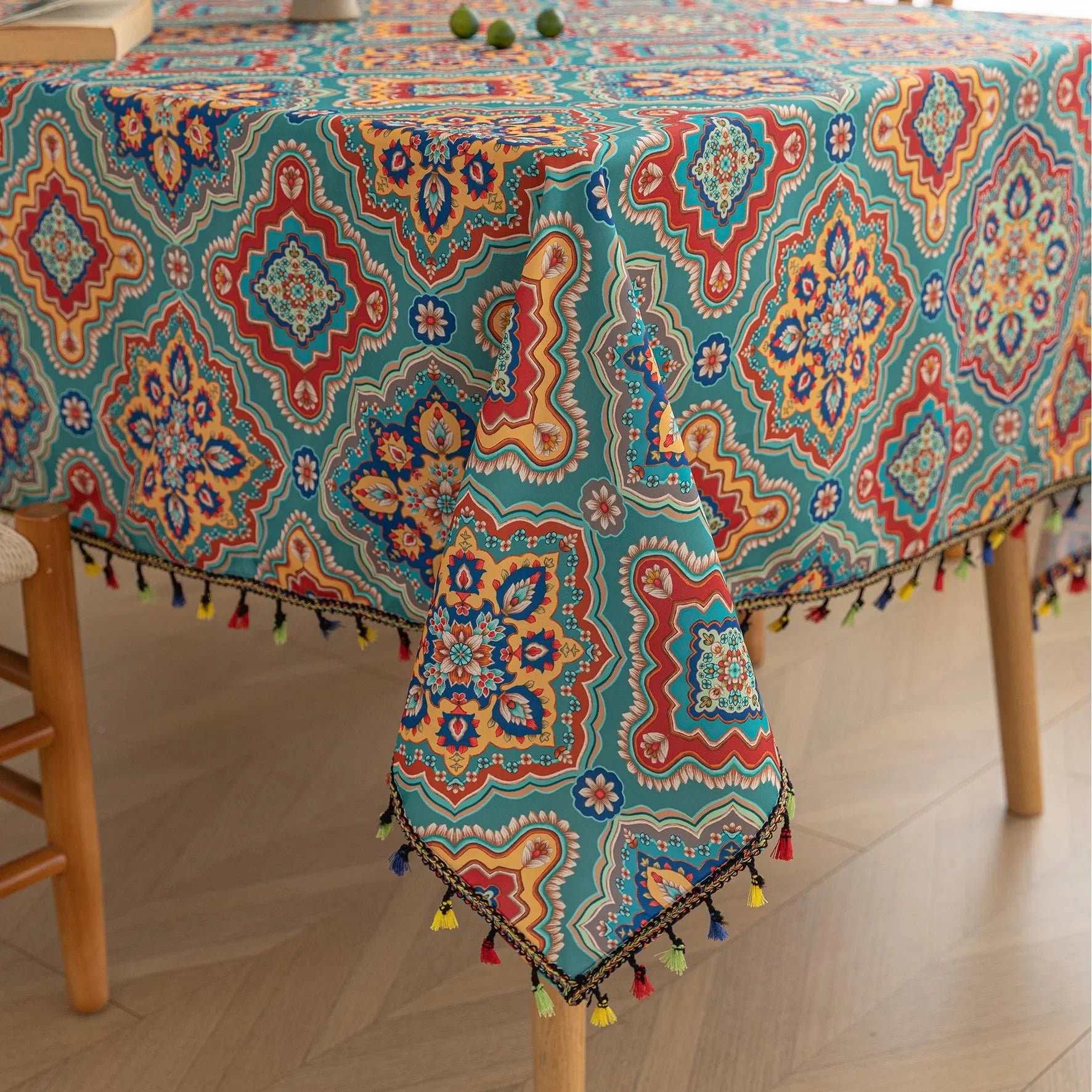 Bohemian Rectangle Tablecloth ¨C Add vibrant charm to your dining area with this colorful round tablecloth featuring intricate Moroccan-inspired patterns in bold turquoise, red, and yellow hues. Finished with playful multicolor tassels along the edge, it brings a lively boho flair to both indoor and outdoor dining. Perfect for kitchen tables, coffee nooks, or garden parties, this durable and eye-catching tablecloth is ideal for everyday use or special occasions.
