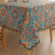 Bohemian Rectangle Tablecloth ¨C Add vibrant charm to your dining area with this colorful round tablecloth featuring intricate Moroccan-inspired patterns in bold turquoise, red, and yellow hues. Finished with playful multicolor tassels along the edge, it brings a lively boho flair to both indoor and outdoor dining. Perfect for kitchen tables, coffee nooks, or garden parties, this durable and eye-catching tablecloth is ideal for everyday use or special occasions.
