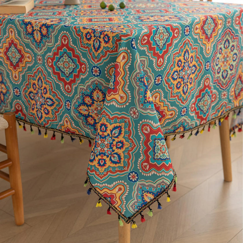 Bohemian Rectangle Tablecloth ¨C Add vibrant charm to your dining area with this colorful round tablecloth featuring intricate Moroccan-inspired patterns in bold turquoise, red, and yellow hues. Finished with playful multicolor tassels along the edge, it brings a lively boho flair to both indoor and outdoor dining. Perfect for kitchen tables, coffee nooks, or garden parties, this durable and eye-catching tablecloth is ideal for everyday use or special occasions.
