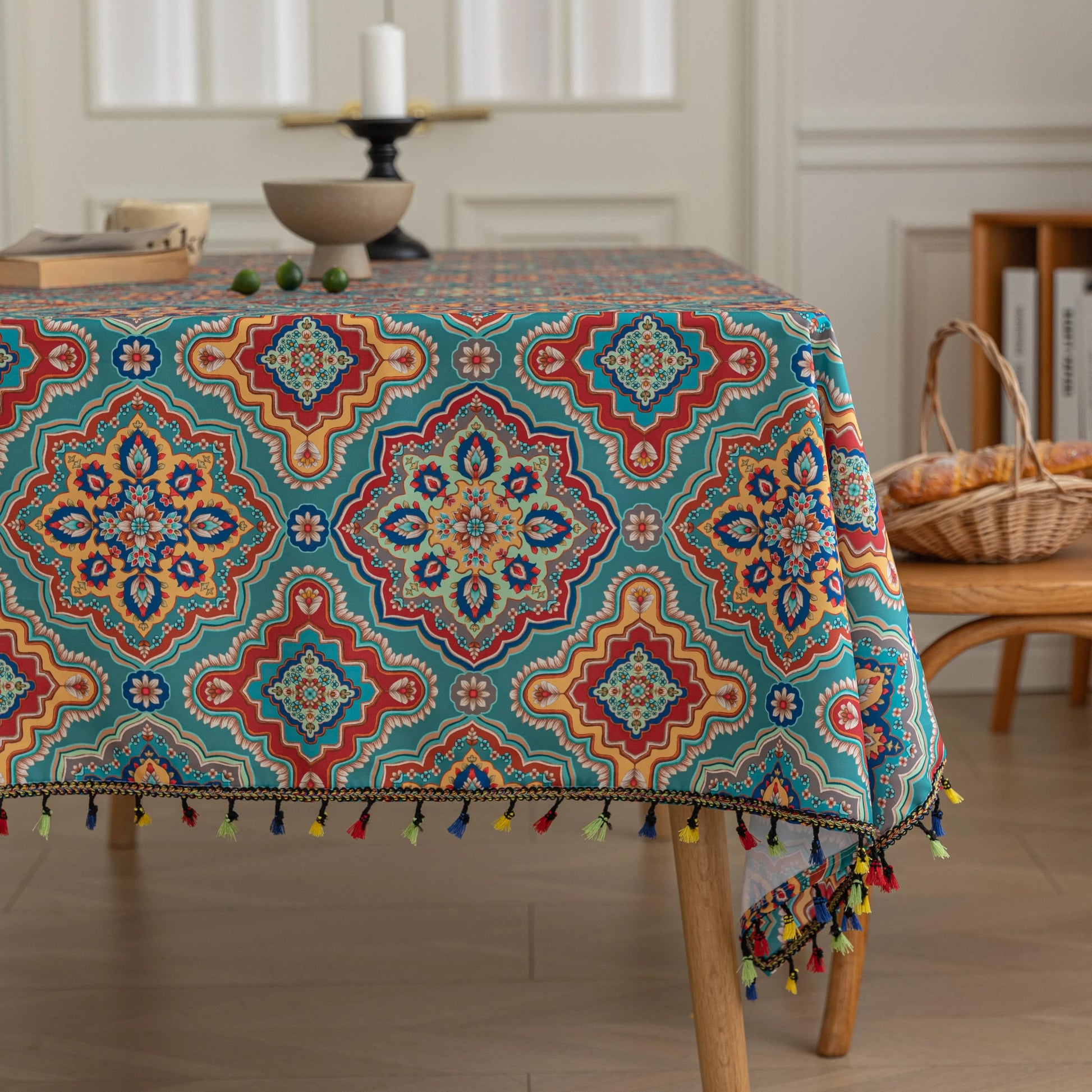 Bohemian Rectangle Tablecloth – Add vibrant charm to your dining area with this colorful round tablecloth featuring intricate Moroccan-inspired patterns in bold turquoise, red, and yellow hues. Finished with playful multicolor tassels along the edge, it brings a lively boho flair to both indoor and outdoor dining. Perfect for kitchen tables, coffee nooks, or garden parties, this durable and eye-catching tablecloth is ideal for everyday use or special occasions.
