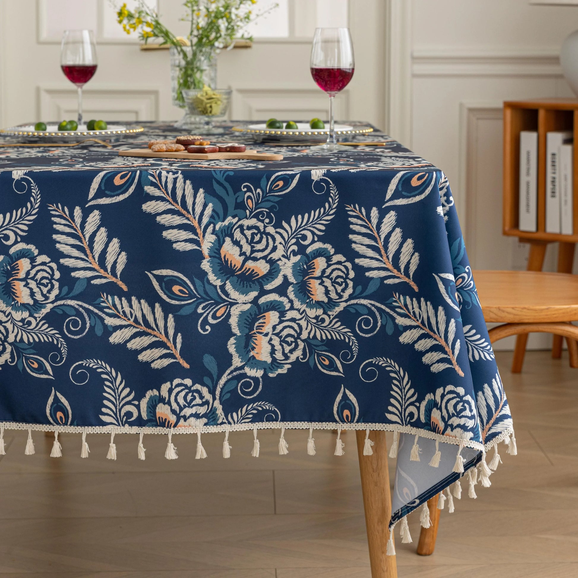 Elegant Floral RectangleTablecloth – Enhance your dining space with this stylish round tablecloth featuring a deep navy blue background adorned with delicate white and beige floral patterns. Accented with charming white tassels along the edge, it brings a refined yet cozy touch to your table décor. Perfect for everyday meals, afternoon tea, or special gatherings, this durable and decorative tablecloth suits both modern and classic interiors.
