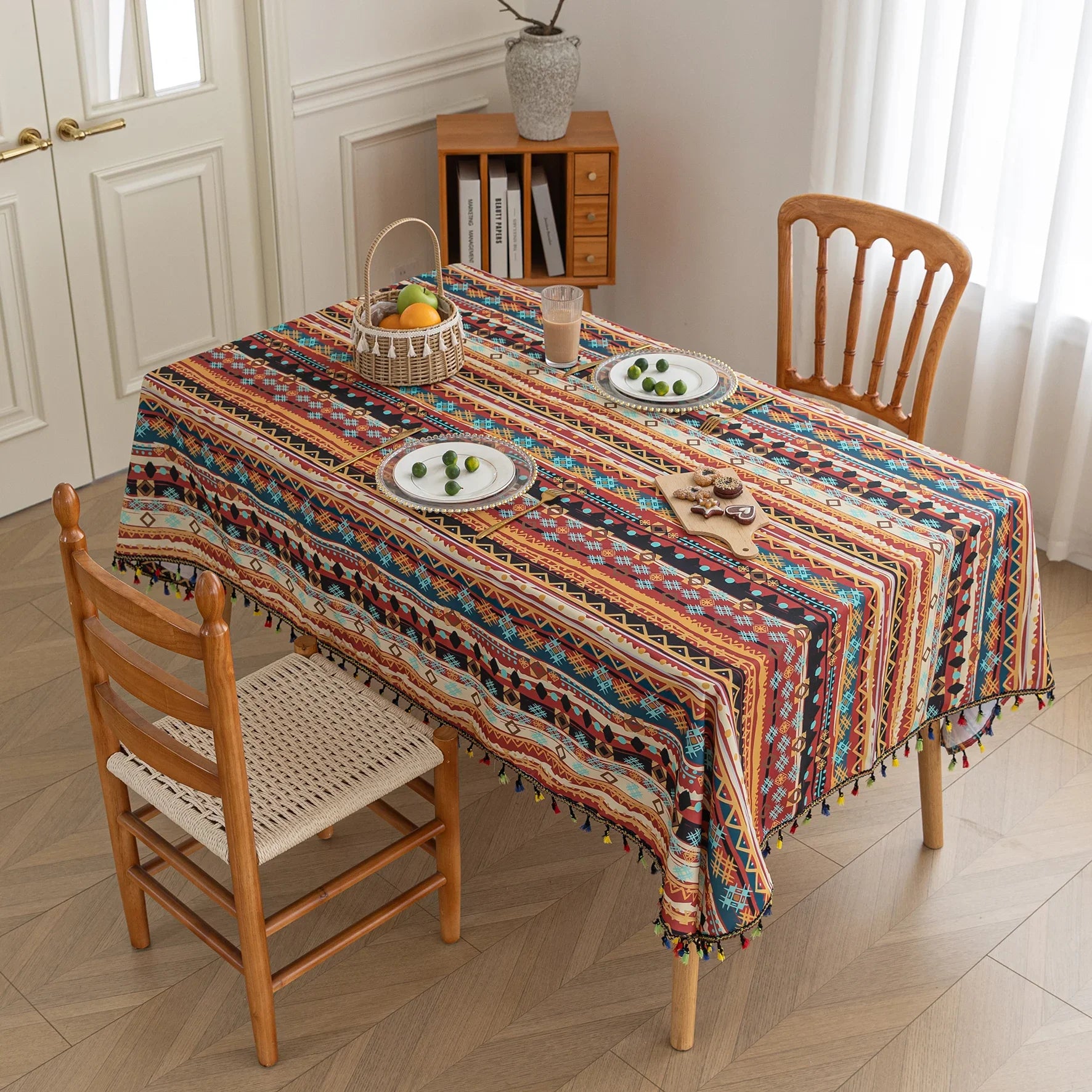 Vibrant bohemian tablecloth with colorful geometric patterns and playful tassel trim ¡ª perfect for adding warmth and personality to dining tables, picnics, and festive gatherings.