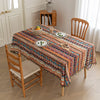 Vibrant bohemian tablecloth with colorful geometric patterns and playful tassel trim ¡ª perfect for adding warmth and personality to dining tables, picnics, and festive gatherings.
