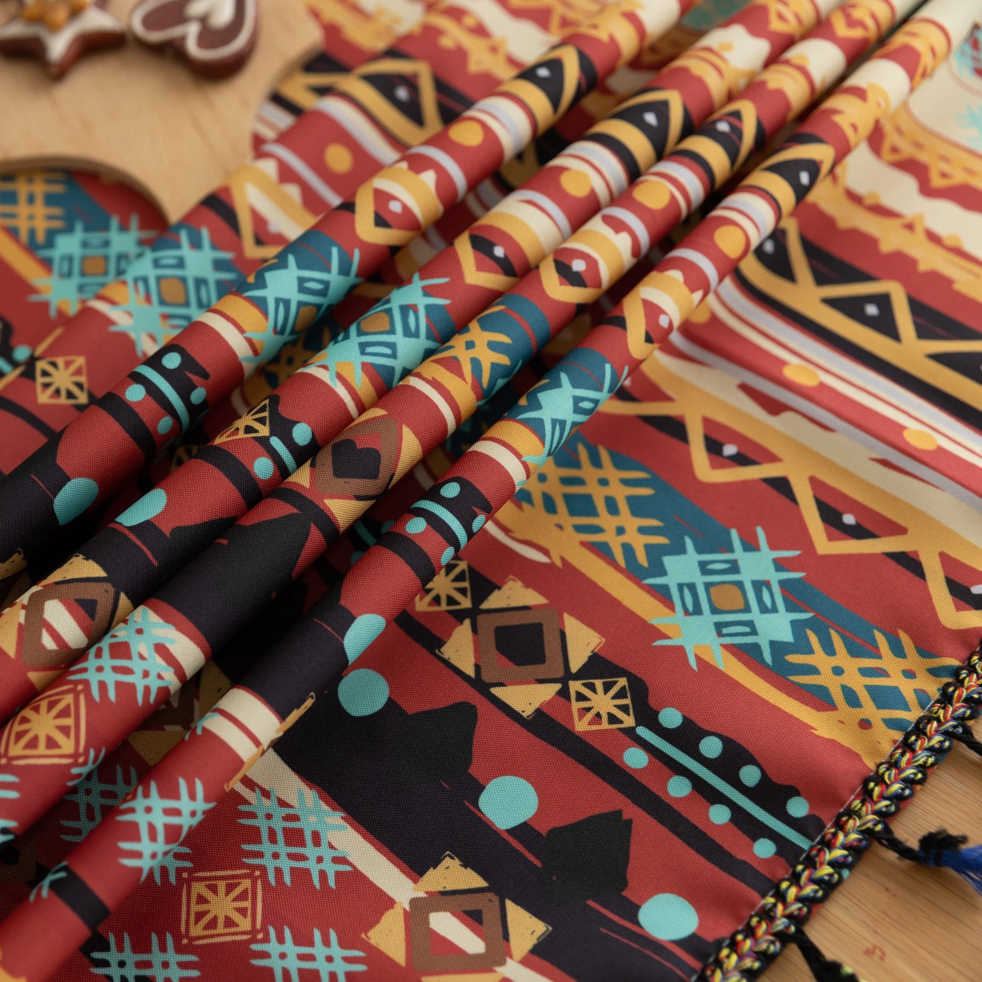 Vibrant bohemian tablecloth with colorful geometric patterns and playful tassel trim — perfect for adding warmth and personality to dining tables, picnics, and festive gatherings.