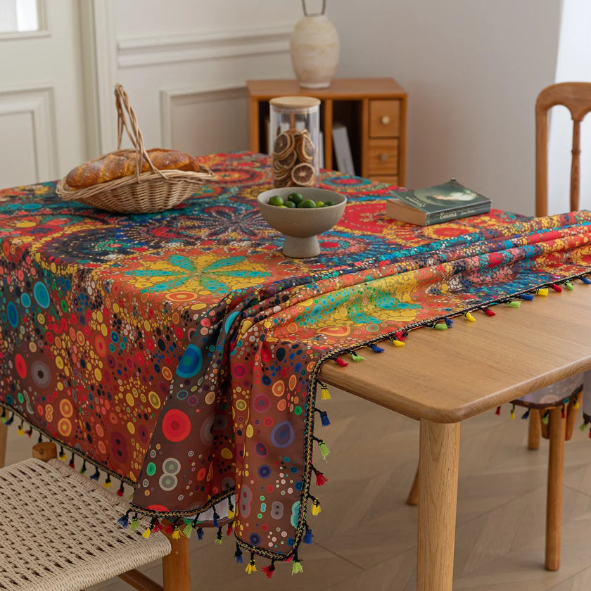 Colorful mandala tablecloth with intricate bohemian patterns and playful tassel edging ¡ª ideal for brightening up dining tables, outdoor picnics, or festive celebrations with vibrant charm.