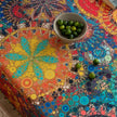 Colorful mandala tablecloth with intricate bohemian patterns and playful tassel edging ¡ª ideal for brightening up dining tables, outdoor picnics, or festive celebrations with vibrant charm.