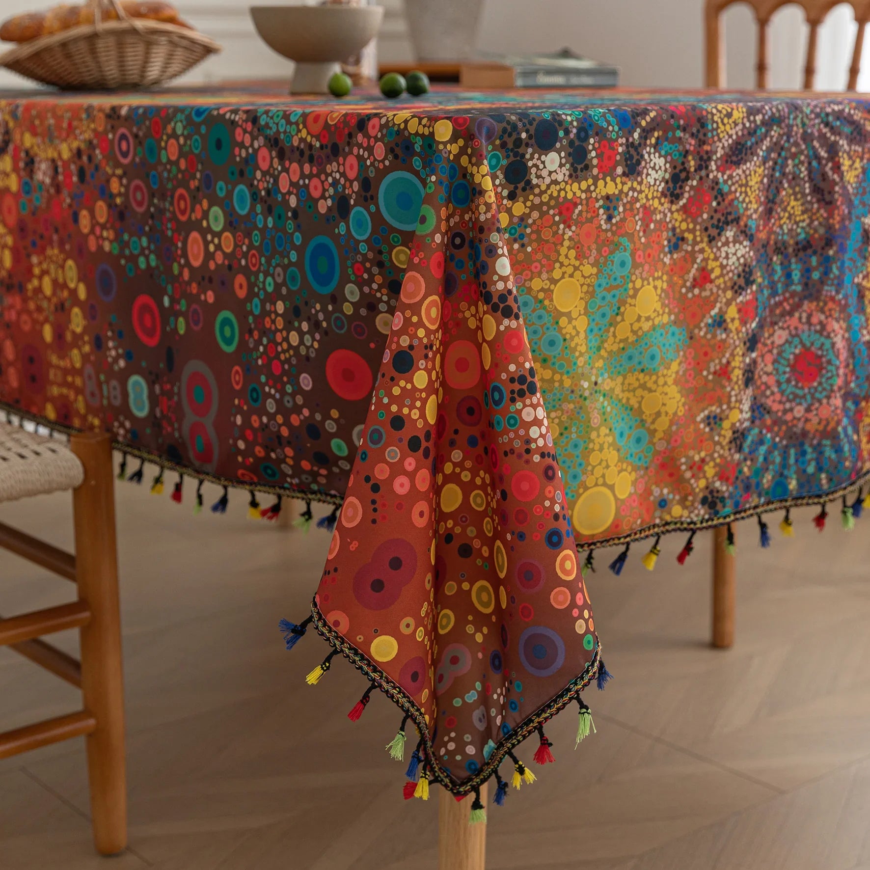 Colorful mandala tablecloth with intricate bohemian patterns and playful tassel edging — ideal for brightening up dining tables, outdoor picnics, or festive celebrations with vibrant charm.