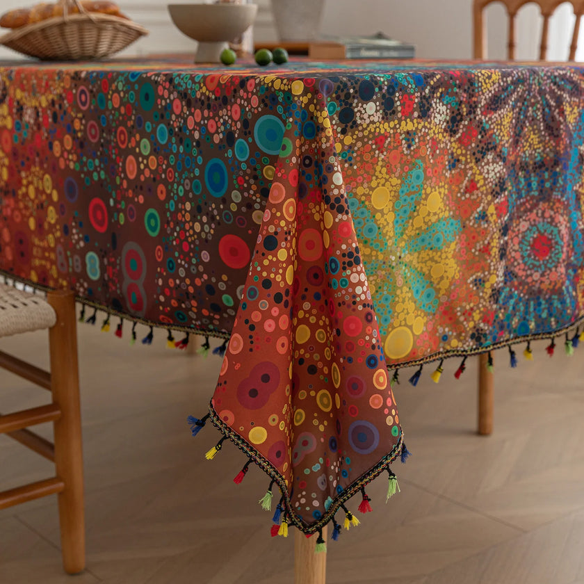 Colorful mandala tablecloth with intricate bohemian patterns and playful tassel edging ¡ª ideal for brightening up dining tables, outdoor picnics, or festive celebrations with vibrant charm.