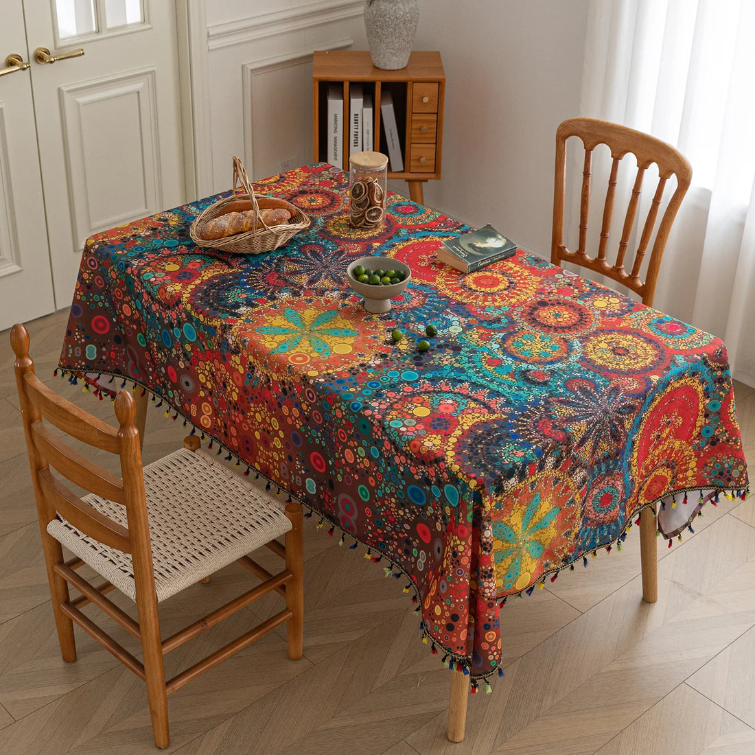 Colorful mandala tablecloth with intricate bohemian patterns and playful tassel edging — ideal for brightening up dining tables, outdoor picnics, or festive celebrations with vibrant charm.