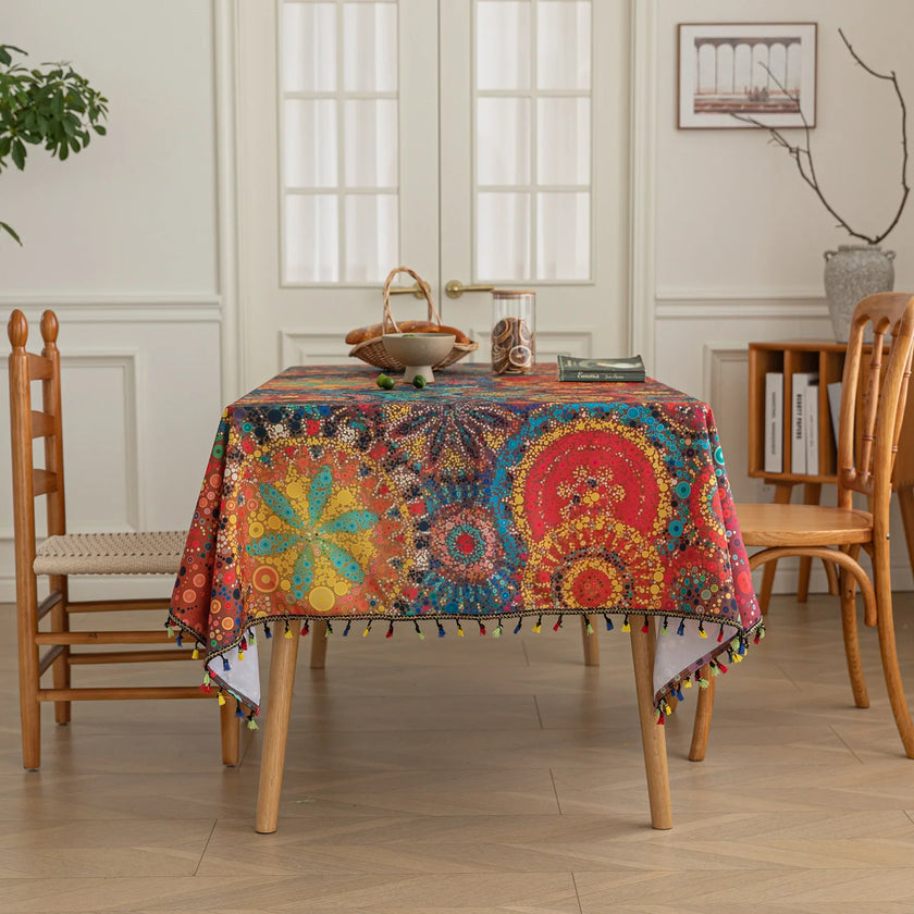 Colorful mandala tablecloth with intricate bohemian patterns and playful tassel edging ¡ª ideal for brightening up dining tables, outdoor picnics, or festive celebrations with vibrant charm.