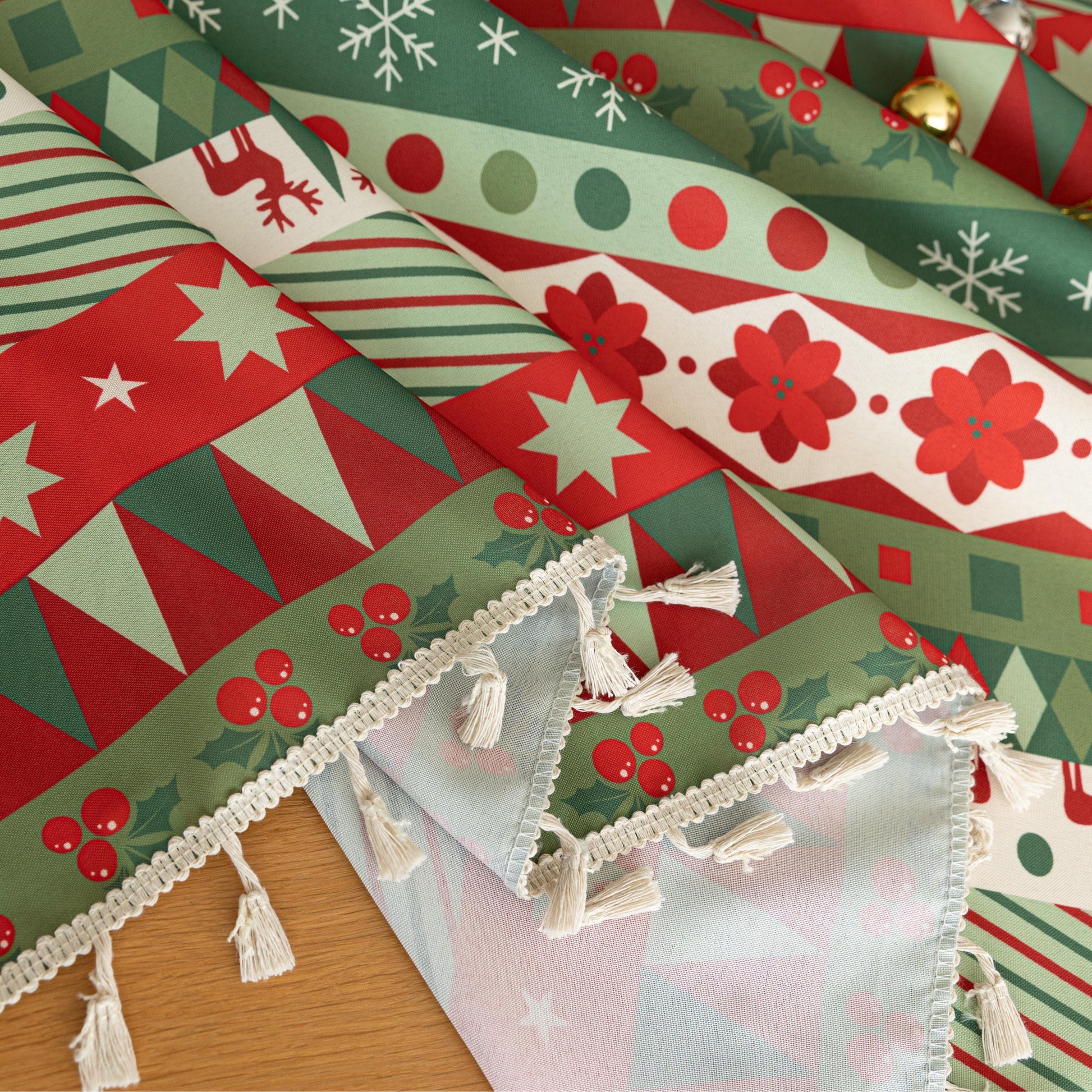 Festive Christmas tablecloth with red, green, and white patterns, perfect for holiday dining décor and creating a warm, cheerful atmosphere