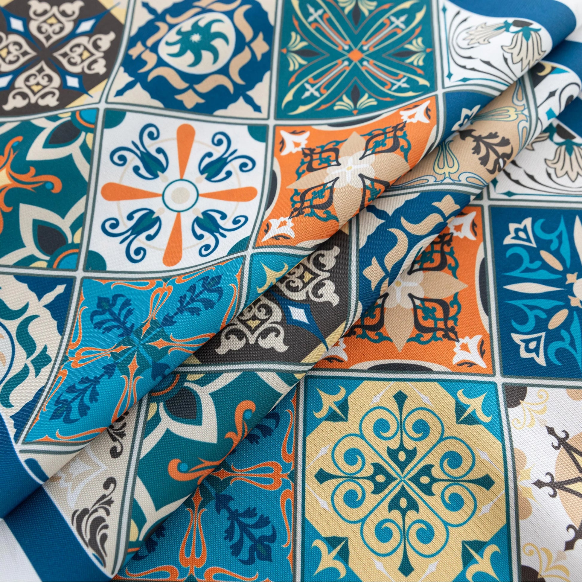 Elegant boho-style tablecloth with colorful geometric patterns and tassels, perfect for adding charm and protecting your dining table.
