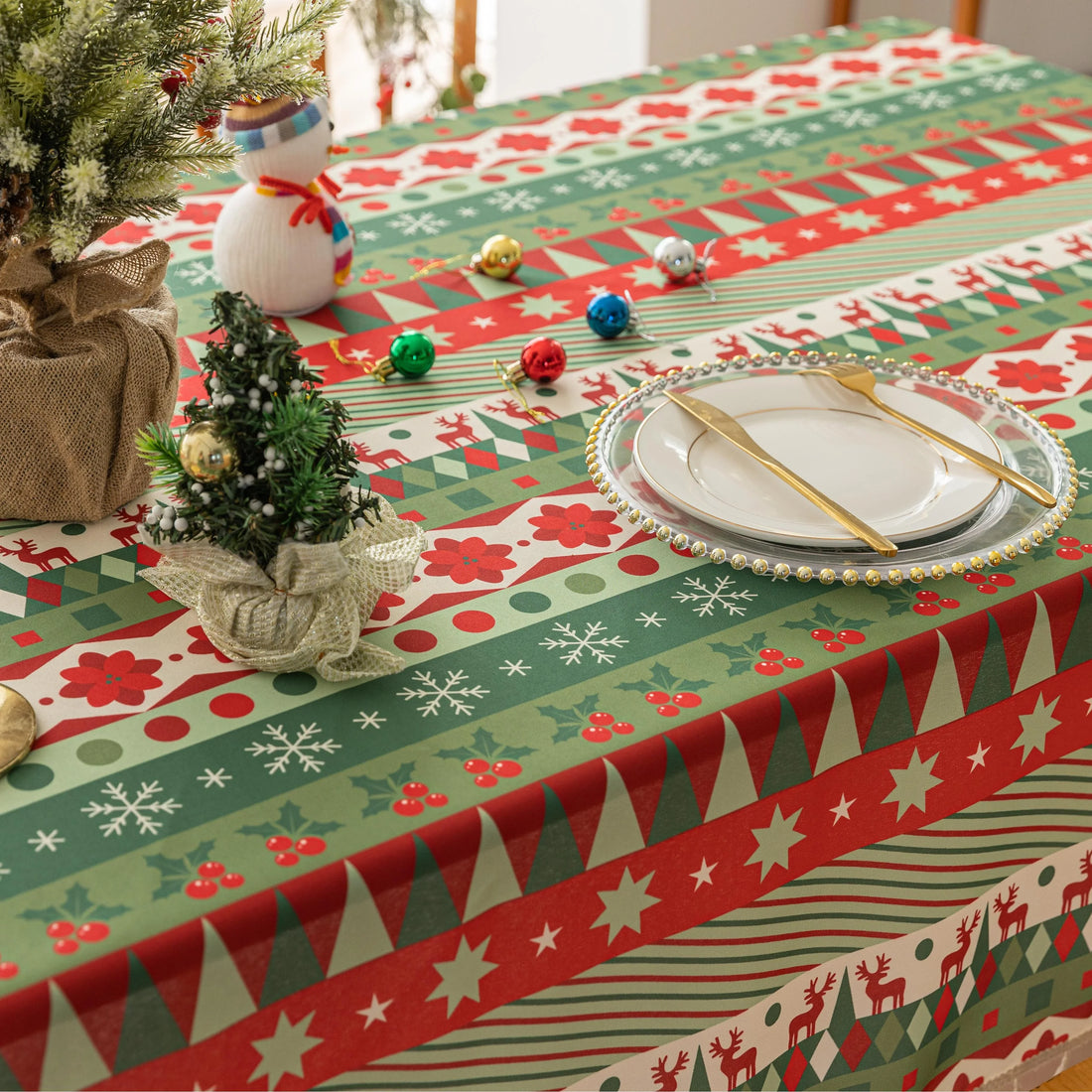 Festive Christmas tablecloth with red, green, and white patterns, perfect for holiday dining décor and creating a warm, cheerful atmosphere