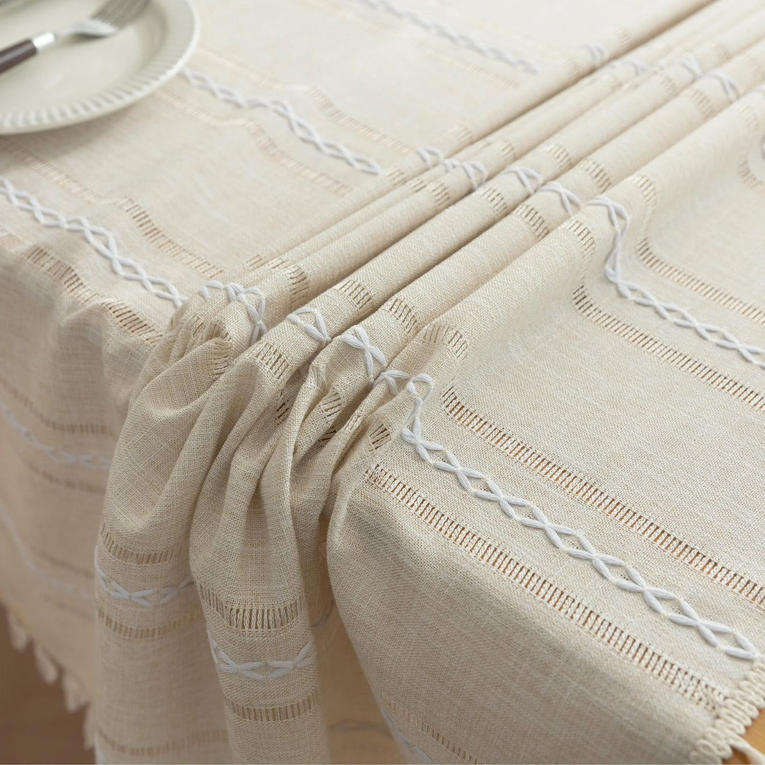Beige Linen Tassel Tablecloth – Elevate your dining area with this elegant beige tablecloth, crafted from a soft linen-blend fabric for a natural, breathable feel. Featuring subtle white woven stripes and charming tassel edges, it adds a touch of rustic sophistication to both casual meals and festive gatherings. Durable, easy to maintain, and versatile in style, this tablecloth blends seamlessly with farmhouse, bohemian, or modern home décor while protecting your table in timeless fashion.
