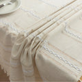 Beige Linen Tassel Tablecloth – Elevate your dining area with this elegant beige tablecloth, crafted from a soft linen-blend fabric for a natural, breathable feel. Featuring subtle white woven stripes and charming tassel edges, it adds a touch of rustic sophistication to both casual meals and festive gatherings. Durable, easy to maintain, and versatile in style, this tablecloth blends seamlessly with farmhouse, bohemian, or modern home décor while protecting your table in timeless fashion.
