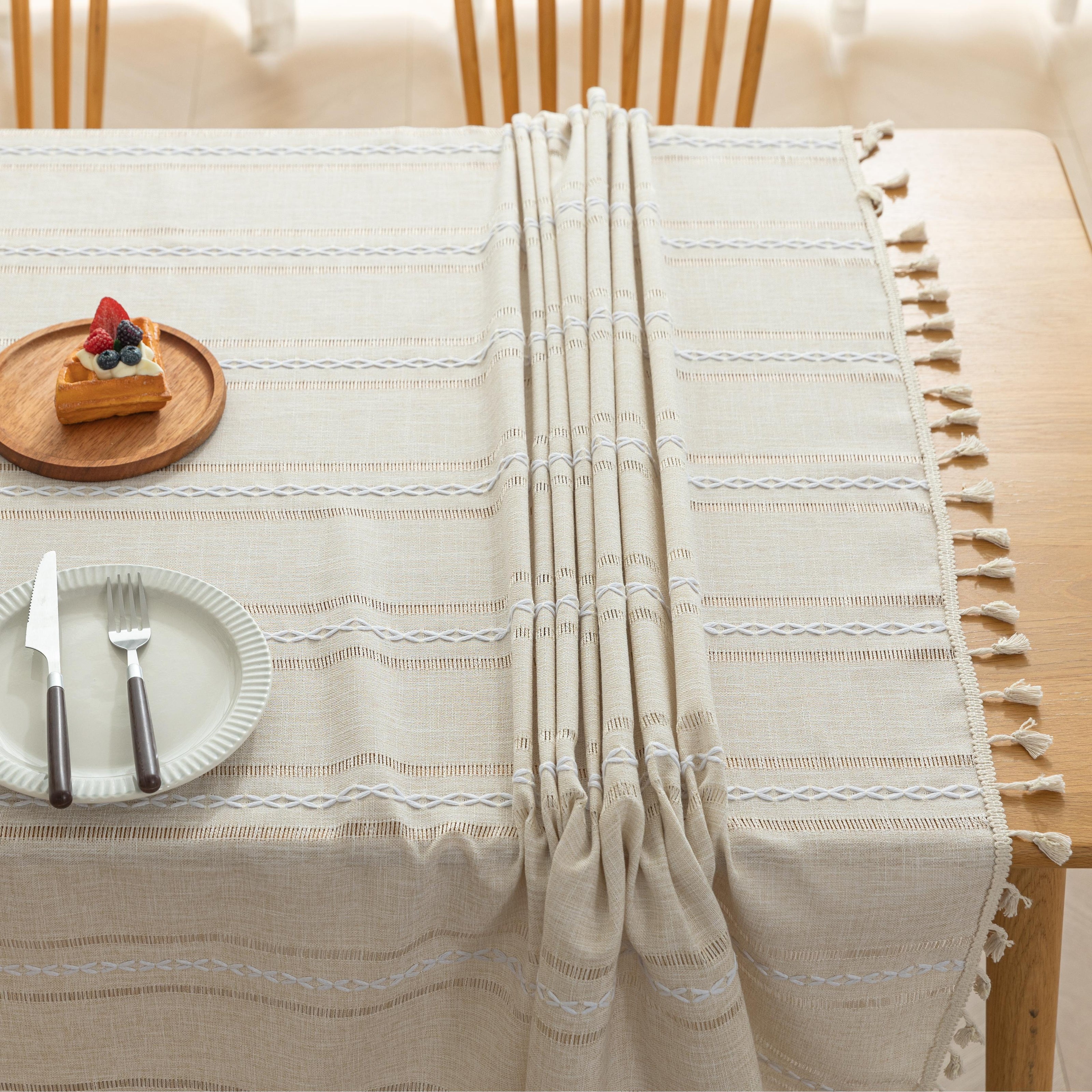 Beige Linen Tassel Tablecloth ¨C Elevate your dining area with this elegant beige tablecloth, crafted from a soft linen-blend fabric for a natural, breathable feel. Featuring subtle white woven stripes and charming tassel edges, it adds a touch of rustic sophistication to both casual meals and festive gatherings. Durable, easy to maintain, and versatile in style, this tablecloth blends seamlessly with farmhouse, bohemian, or modern home d¨¦cor while protecting your table in timeless fashion.
