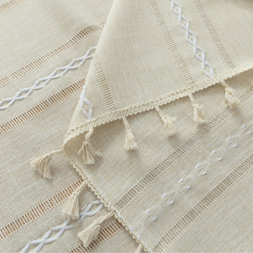 Beige Linen Tassel Tablecloth – Elevate your dining area with this elegant beige tablecloth, crafted from a soft linen-blend fabric for a natural, breathable feel. Featuring subtle white woven stripes and charming tassel edges, it adds a touch of rustic sophistication to both casual meals and festive gatherings. Durable, easy to maintain, and versatile in style, this tablecloth blends seamlessly with farmhouse, bohemian, or modern home décor while protecting your table in timeless fashion.
