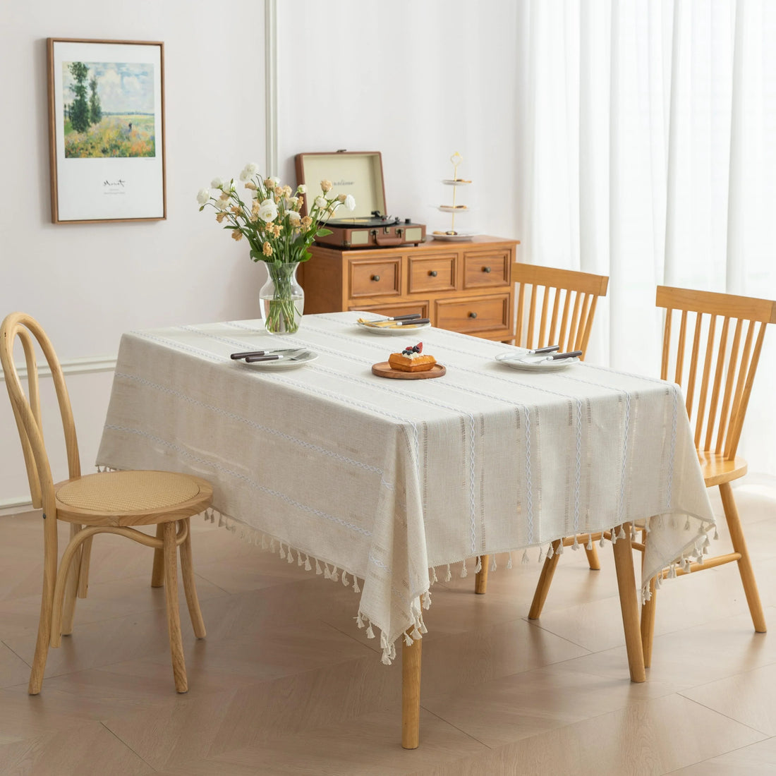 Beige Linen Tassel Tablecloth – Elevate your dining area with this elegant beige tablecloth, crafted from a soft linen-blend fabric for a natural, breathable feel. Featuring subtle white woven stripes and charming tassel edges, it adds a touch of rustic sophistication to both casual meals and festive gatherings. Durable, easy to maintain, and versatile in style, this tablecloth blends seamlessly with farmhouse, bohemian, or modern home décor while protecting your table in timeless fashion.
