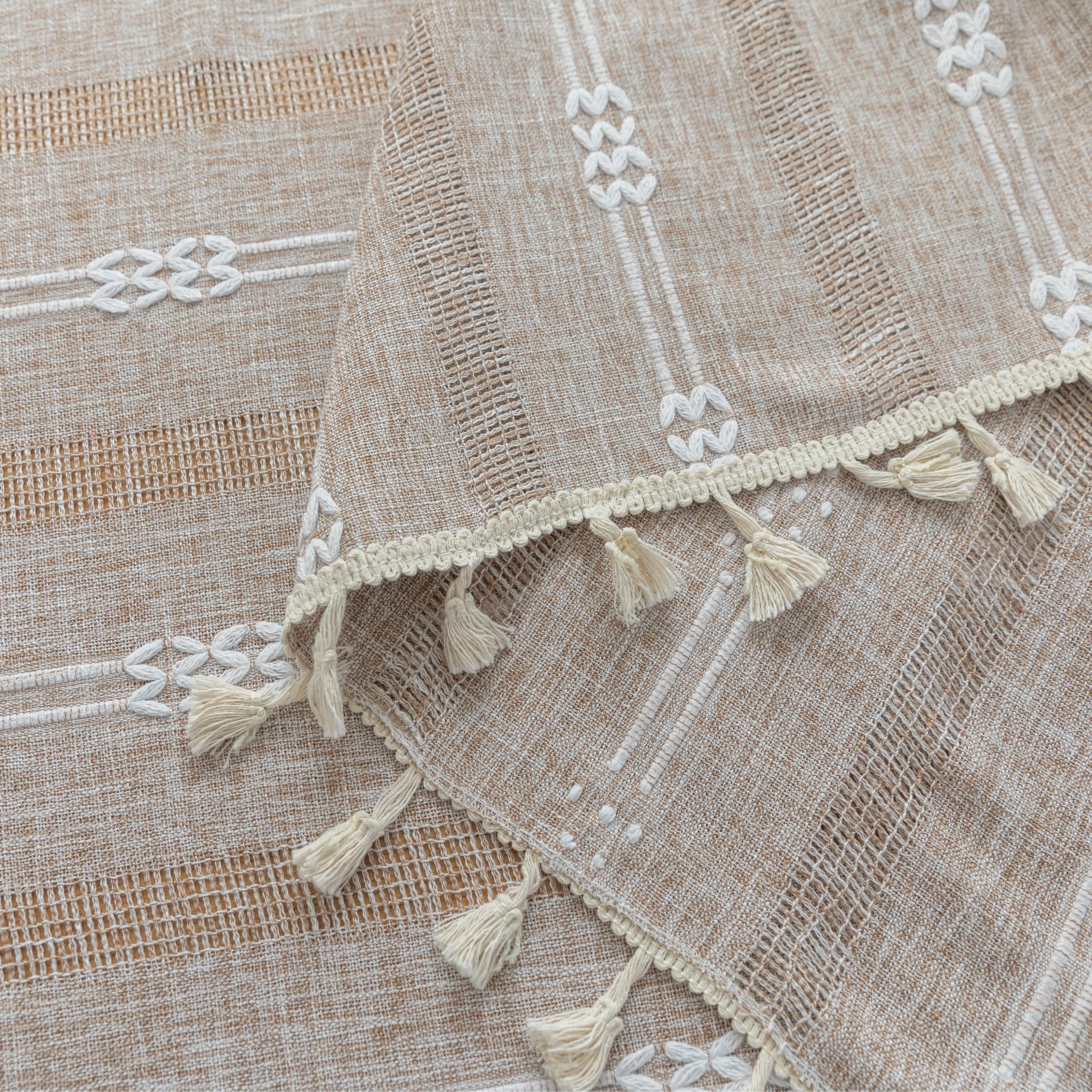 Rustic Linen Tassel Tablecloth ¨C Add a touch of natural elegance to your dining space with this beautiful linen-blend tablecloth, featuring delicate white embroidered stripes and charming tassel edging. Its neutral beige tone effortlessly complements farmhouse, bohemian, and modern interiors, making it perfect for everyday meals or special gatherings. Durable, soft, and easy to clean, this tablecloth not only protects your table but also enhances your dining experience with timeless style and texture.
