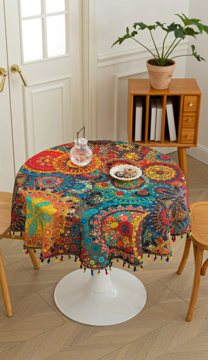 Colorful Bohemian Round Tablecloth ¨C Brighten your dining space with this vibrant round tablecloth featuring an eclectic mix of circular mandala-inspired patterns in bold red, yellow, turquoise, and blue hues. Accented with playful multicolor tassels, it adds a lively and artistic touch to any table setting. Perfect for kitchen tables, garden parties, picnics, or festive gatherings, this durable and eye-catching tablecloth is ideal for both everyday meals and special occasions.
