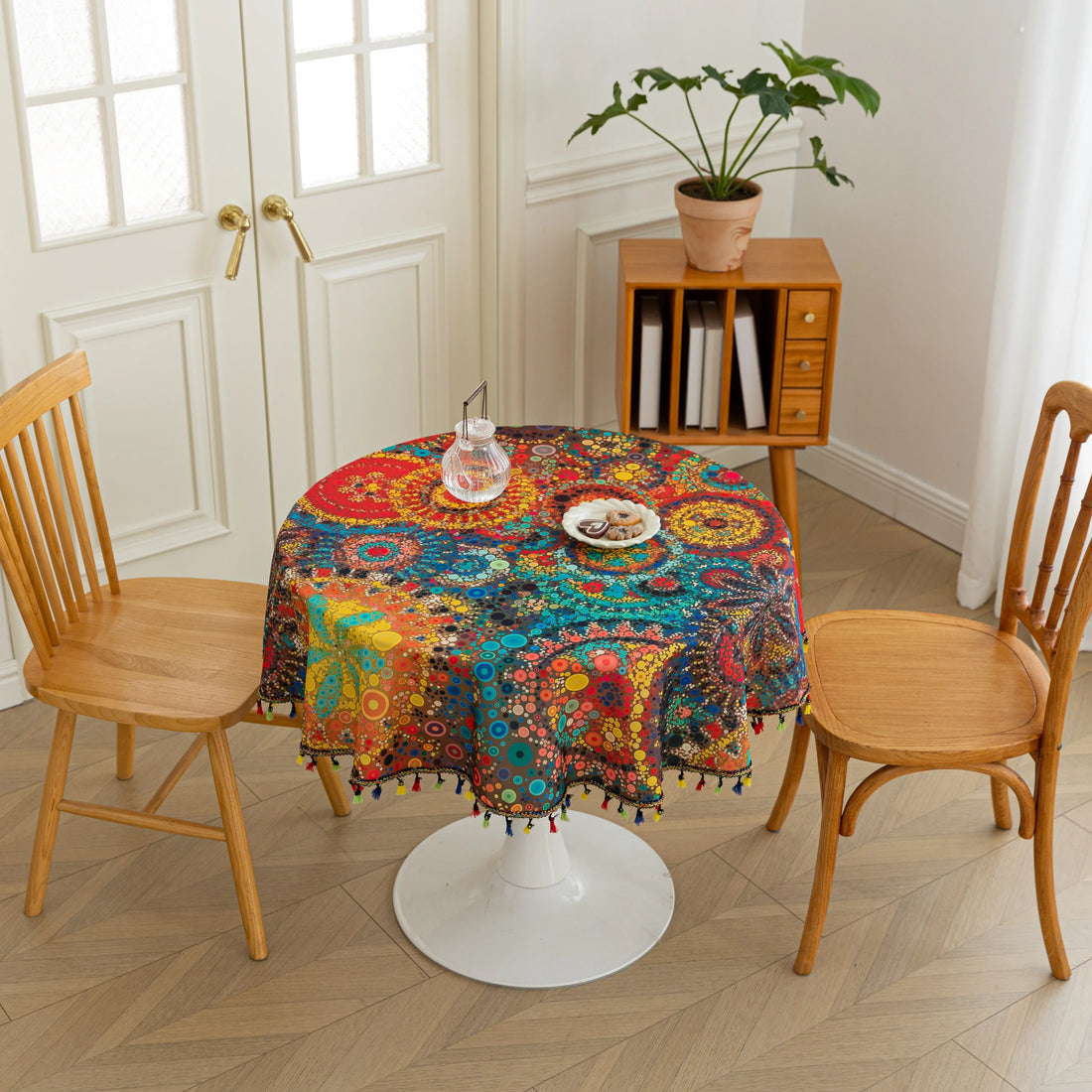Colorful Bohemian Round Tablecloth – Brighten your dining space with this vibrant round tablecloth featuring an eclectic mix of circular mandala-inspired patterns in bold red, yellow, turquoise, and blue hues. Accented with playful multicolor tassels, it adds a lively and artistic touch to any table setting. Perfect for kitchen tables, garden parties, picnics, or festive gatherings, this durable and eye-catching tablecloth is ideal for both everyday meals and special occasions.
