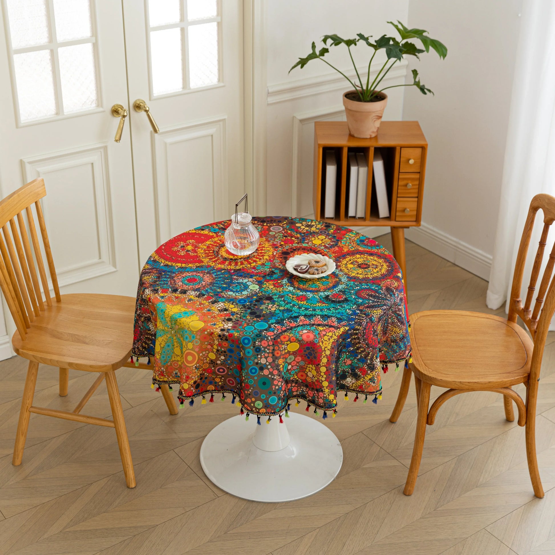 Colorful Bohemian Round Tablecloth – Brighten your dining space with this vibrant round tablecloth featuring an eclectic mix of circular mandala-inspired patterns in bold red, yellow, turquoise, and blue hues. Accented with playful multicolor tassels, it adds a lively and artistic touch to any table setting. Perfect for kitchen tables, garden parties, picnics, or festive gatherings, this durable and eye-catching tablecloth is ideal for both everyday meals and special occasions.
