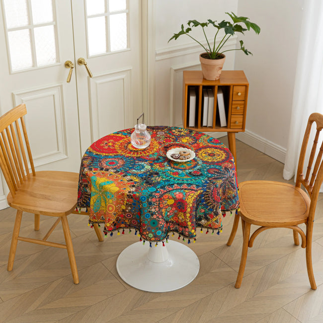 Colorful Bohemian Round Tablecloth ¨C Brighten your dining space with this vibrant round tablecloth featuring an eclectic mix of circular mandala-inspired patterns in bold red, yellow, turquoise, and blue hues. Accented with playful multicolor tassels, it adds a lively and artistic touch to any table setting. Perfect for kitchen tables, garden parties, picnics, or festive gatherings, this durable and eye-catching tablecloth is ideal for both everyday meals and special occasions.

