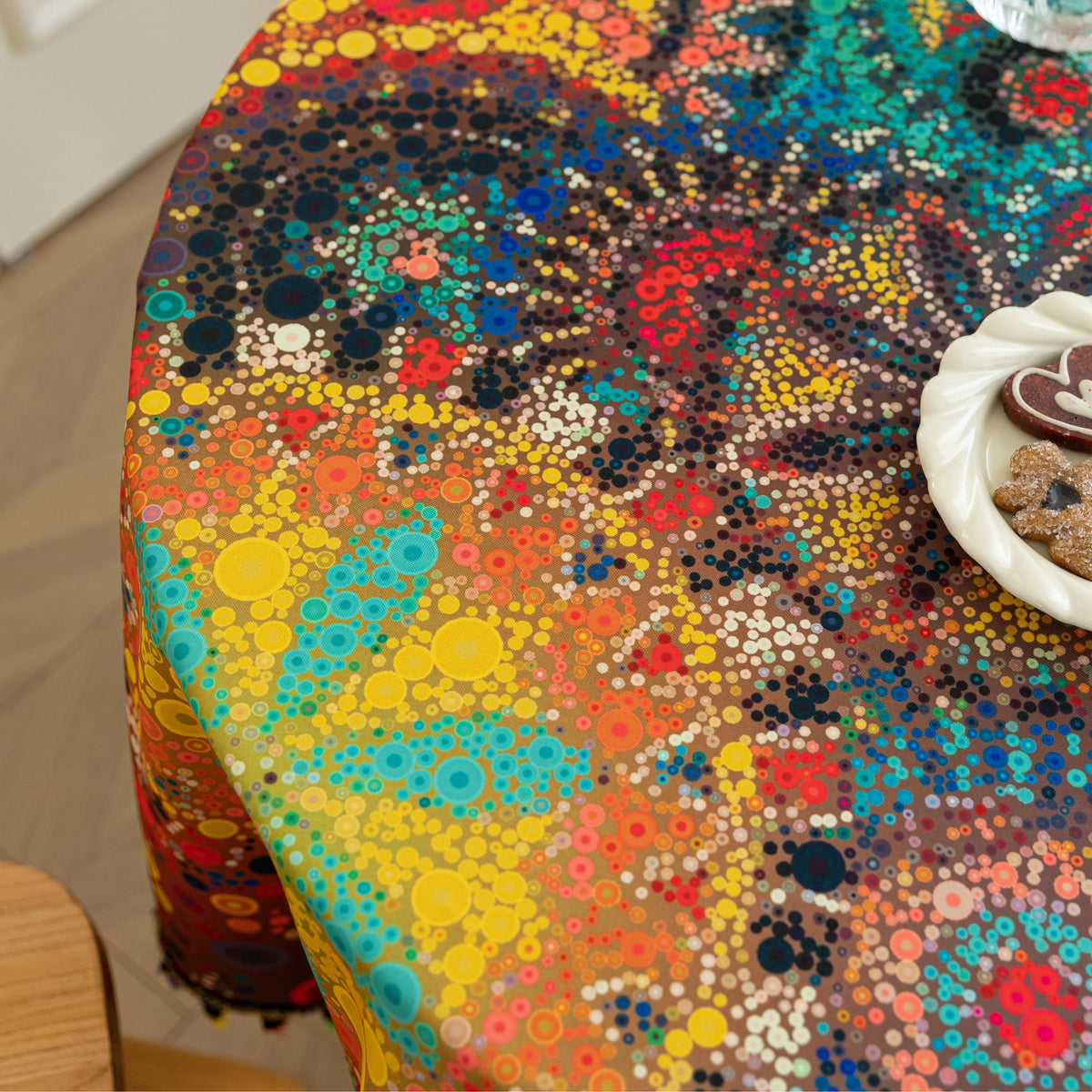 Colorful Bohemian Round Tablecloth ¨C Brighten your dining space with this vibrant round tablecloth featuring an eclectic mix of circular mandala-inspired patterns in bold red, yellow, turquoise, and blue hues. Accented with playful multicolor tassels, it adds a lively and artistic touch to any table setting. Perfect for kitchen tables, garden parties, picnics, or festive gatherings, this durable and eye-catching tablecloth is ideal for both everyday meals and special occasions.
