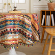 Bohemian Striped Round Tablecloth ¨C Infuse your dining area with vibrant personality using this colorful round tablecloth featuring bold boho-inspired stripes and geometric patterns in rich red, yellow, turquoise, and black tones. Accented with playful multicolor tassels along the edge, it adds a lively and artistic touch to any table setting. Perfect for kitchen tables, coffee nooks, picnics, or festive gatherings, this durable and eye-catching tablecloth is ideal for both everyday use and special occasio