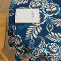 Elegant Floral Round Tablecloth – Enhance your dining space with this stylish round tablecloth featuring a deep navy blue background adorned with delicate white and beige floral patterns. Accented with charming white tassels along the edge, it brings a refined yet cozy touch to your table décor. Perfect for everyday meals, afternoon tea, or special gatherings, this durable and decorative tablecloth suits both modern and classic interiors.
