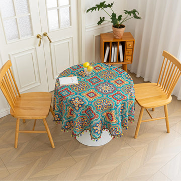 Bohemian Round Tablecloth – Add vibrant charm to your dining area with this colorful round tablecloth featuring intricate Moroccan-inspired patterns in bold turquoise, red, and yellow hues. Finished with playful multicolor tassels along the edge, it brings a lively boho flair to both indoor and outdoor dining. Perfect for kitchen tables, coffee nooks, or garden parties, this durable and eye-catching tablecloth is ideal for everyday use or special occasions.
