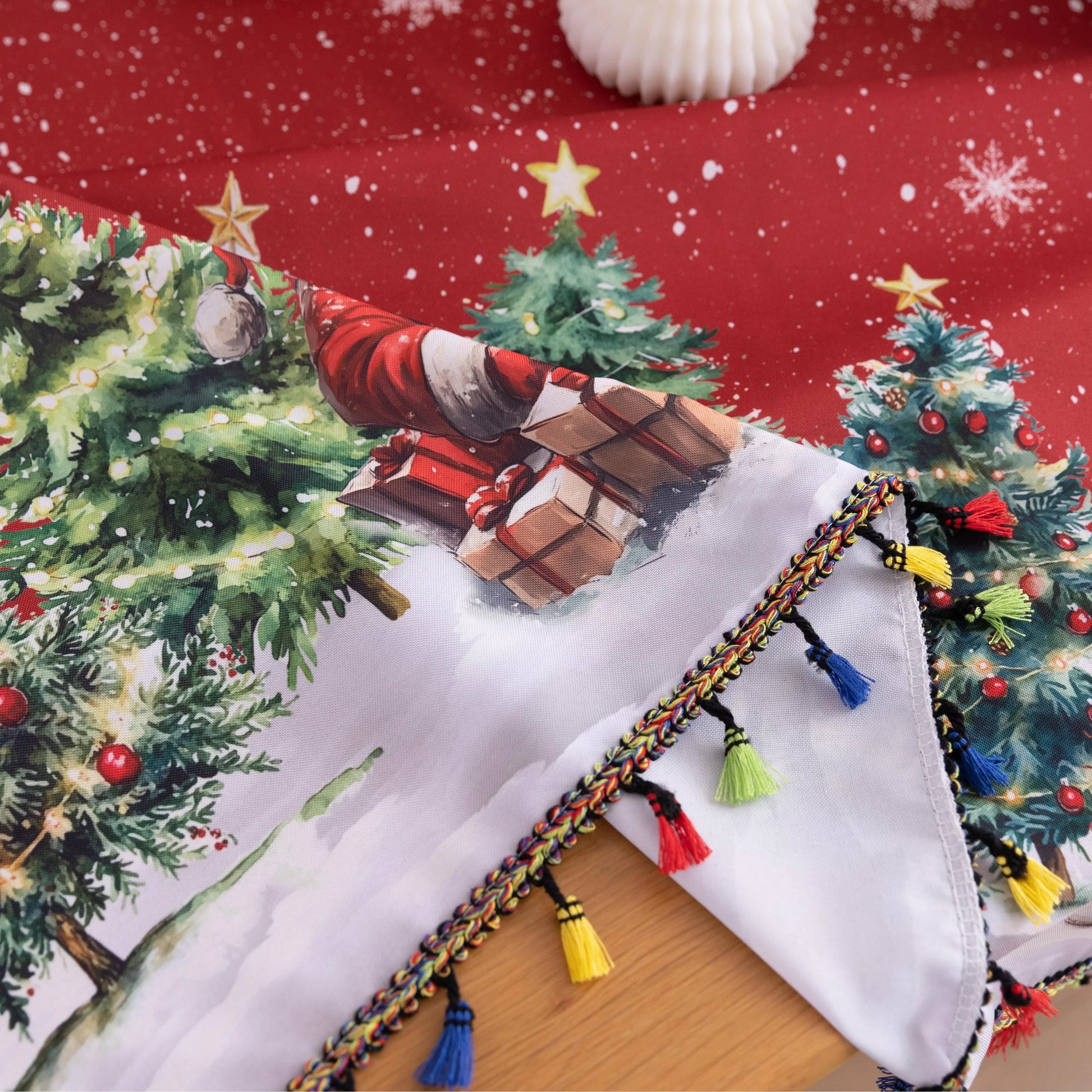 Christmas Santa Round Tablecloth – Bring festive cheer to your holiday table with this charming round tablecloth featuring a snowy winter scene of Santa Claus, Christmas trees, and a cozy cottage. Designed with a vibrant red background, falling snowflakes, and playful multicolor tassels, it creates a warm and joyful atmosphere for your celebrations. Perfect for Christmas dinners, holiday parties, or seasonal décor, this durable and decorative tablecloth adds a magical touch to any dining space.
