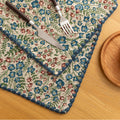 Charming floral woven placemat with blue and red blooms, perfect for adding a fresh, cottage-style touch to your dining table.