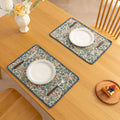 Charming floral woven placemat with blue and red blooms, perfect for adding a fresh, cottage-style touch to your dining table.