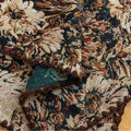 Elegant floral woven placemat in earthy tones, perfect for adding a classic, rustic charm to your dining table while offering durable protection.