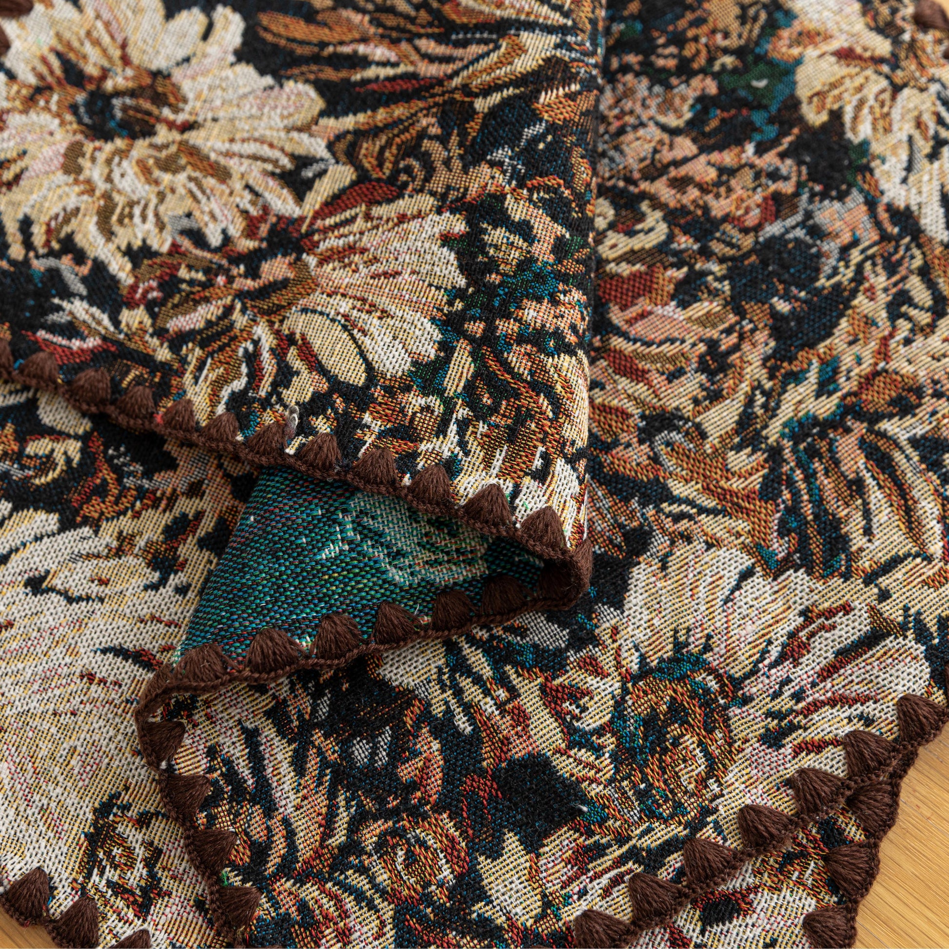 Elegant floral woven placemat in earthy tones, perfect for adding a classic, rustic charm to your dining table while offering durable protection.