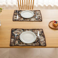 Elegant floral woven placemat in earthy tones, perfect for adding a classic, rustic charm to your dining table while offering durable protection.