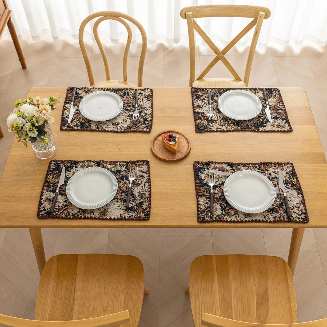 Elegant floral woven placemat in earthy tones, perfect for adding a classic, rustic charm to your dining table while offering durable protection.