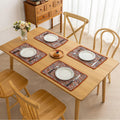 Colorful woven placemat with intricate diamond patterns, adding a vibrant boho touch while protecting your dining table.