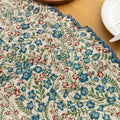 Vintage Floral Table Runner – Bring a touch of timeless charm to your dining space with this beautifully woven table runner featuring delicate blue and red floral patterns on a soft cream background. Accented with a subtle blue border, it adds a fresh and inviting feel to any table setting. Perfect for everyday meals, afternoon tea, or special occasions, this durable and stylish runner complements farmhouse, cottage, and classic home décor styles.

