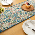 Vintage Floral Table Runner – Bring a touch of timeless charm to your dining space with this beautifully woven table runner featuring delicate blue and red floral patterns on a soft cream background. Accented with a subtle blue border, it adds a fresh and inviting feel to any table setting. Perfect for everyday meals, afternoon tea, or special occasions, this durable and stylish runner complements farmhouse, cottage, and classic home décor styles.


