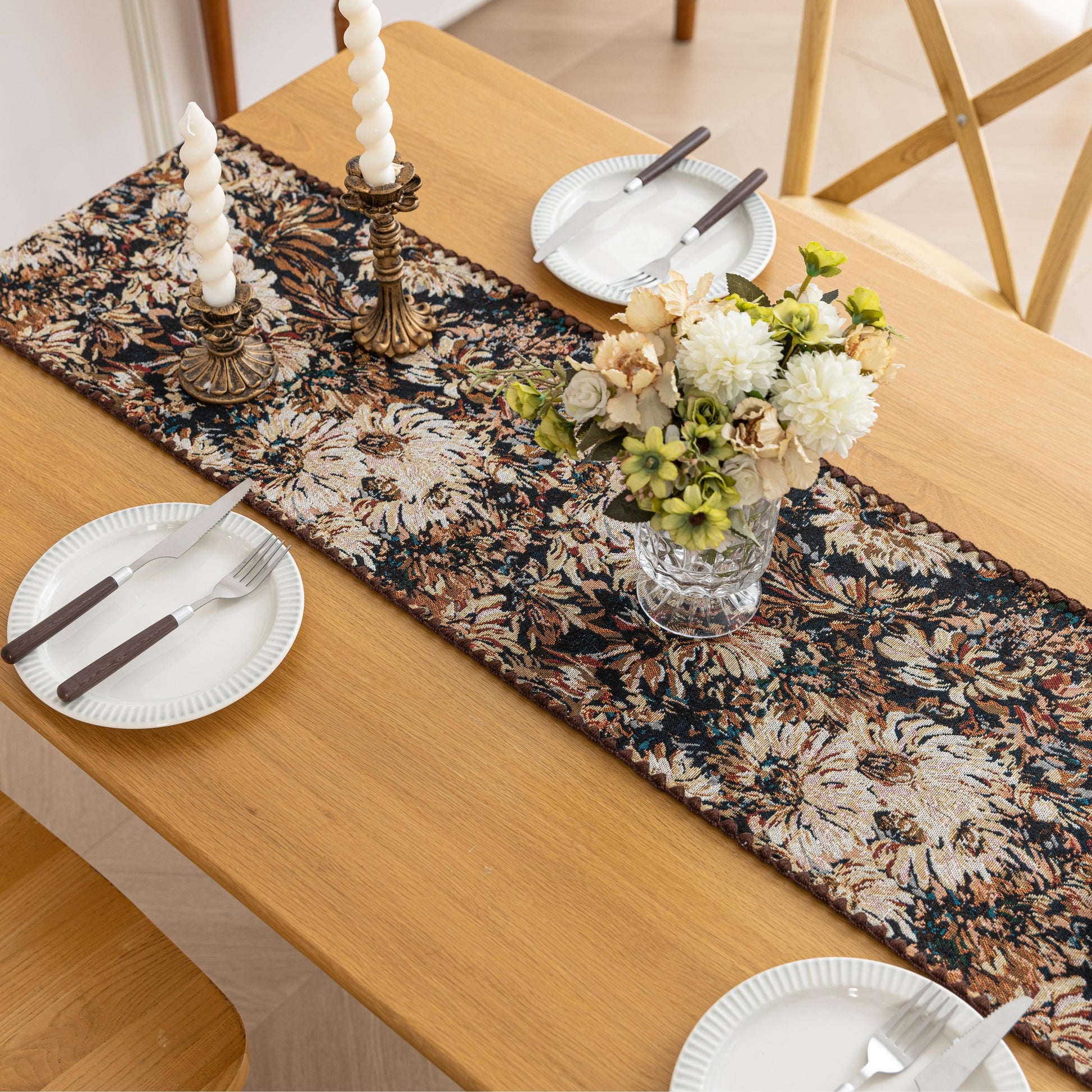 Elegant Floral Table Runner – Elevate your dining experience with this sophisticated table runner featuring an artistic floral pattern in rich, earthy tones. The dark background enhances the intricate botanical design, adding depth and elegance to your table setting. Perfect for formal dinners, festive gatherings, or everyday décor, this durable and stylish runner complements a variety of interior styles, from classic to modern.
