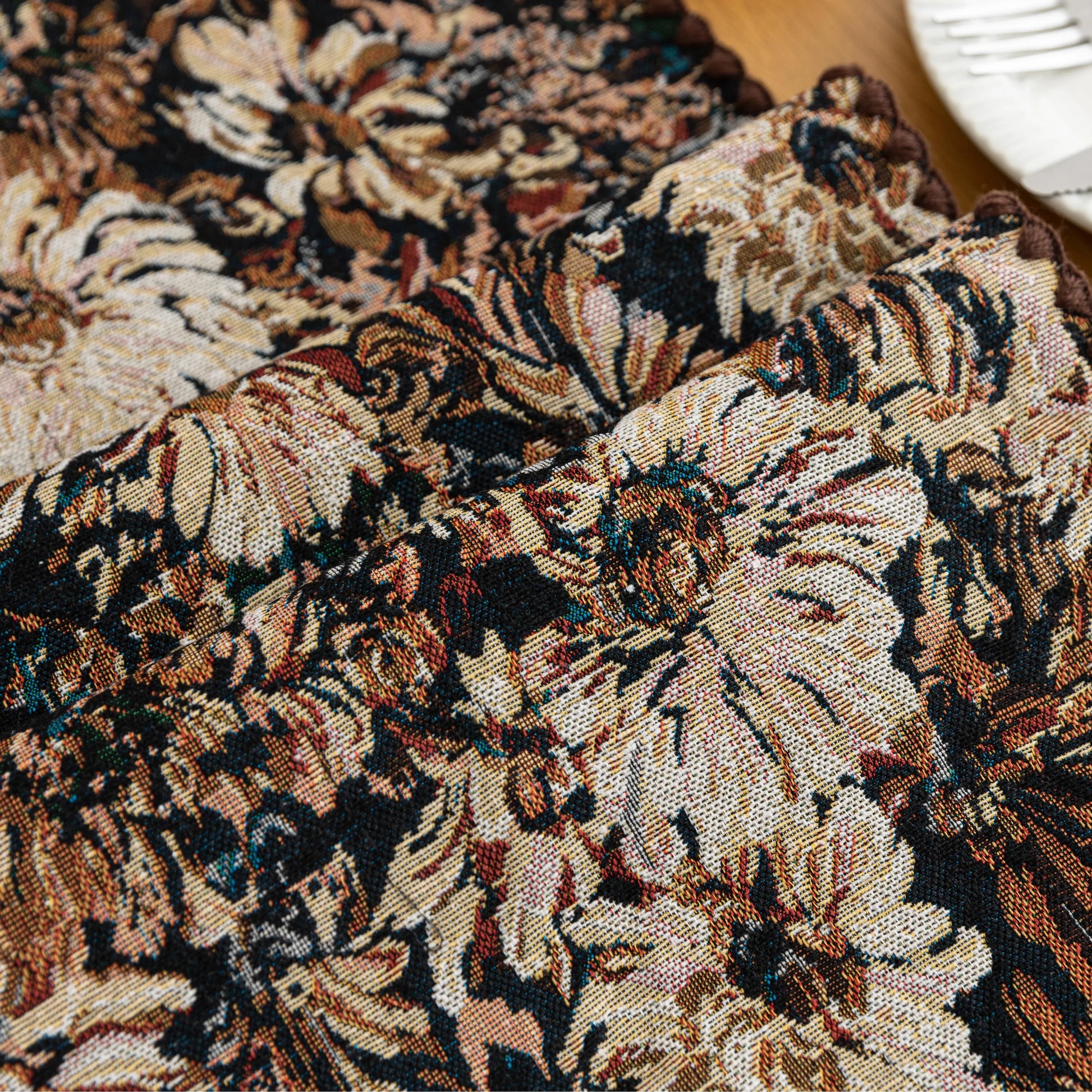 Elegant Floral Table Runner – Elevate your dining experience with this sophisticated table runner featuring an artistic floral pattern in rich, earthy tones. The dark background enhances the intricate botanical design, adding depth and elegance to your table setting. Perfect for formal dinners, festive gatherings, or everyday décor, this durable and stylish runner complements a variety of interior styles, from classic to modern.
